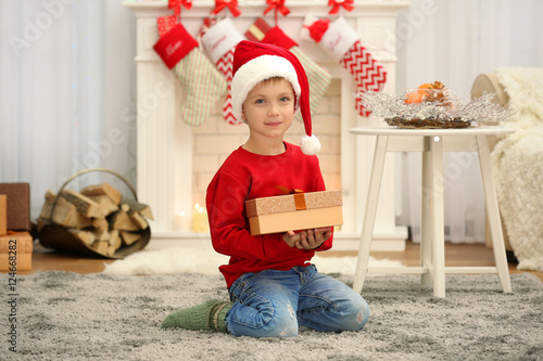 Cute little boy in Santa ha...