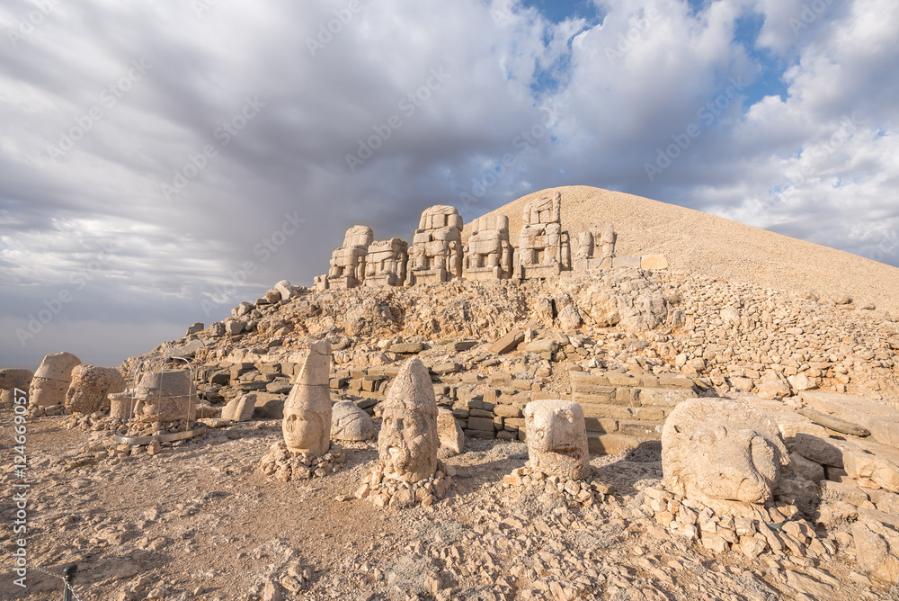 Mount Nemrut at sunrise with the head in front of the statues. The UNESCO World Heritage Site at Mount Nemrut where King Antiochus of Commagene is reputedly entombed Mount Nemrut at sunrise with the head in front of the statues. The UNESCO World Heritage Site at Mount Nemrut where King Antiochus of Commagene is reputedly entombed