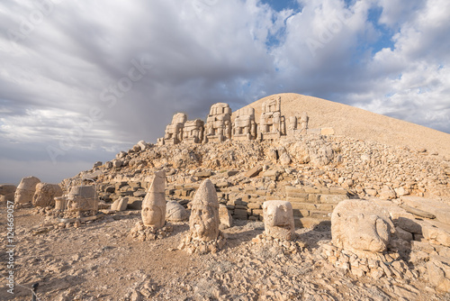 Mount Nemrut at sunrise with the head in front of the statues. The UNESCO World Heritage Site at Mount Nemrut where King Antiochus of Commagene is reputedly entombed photo