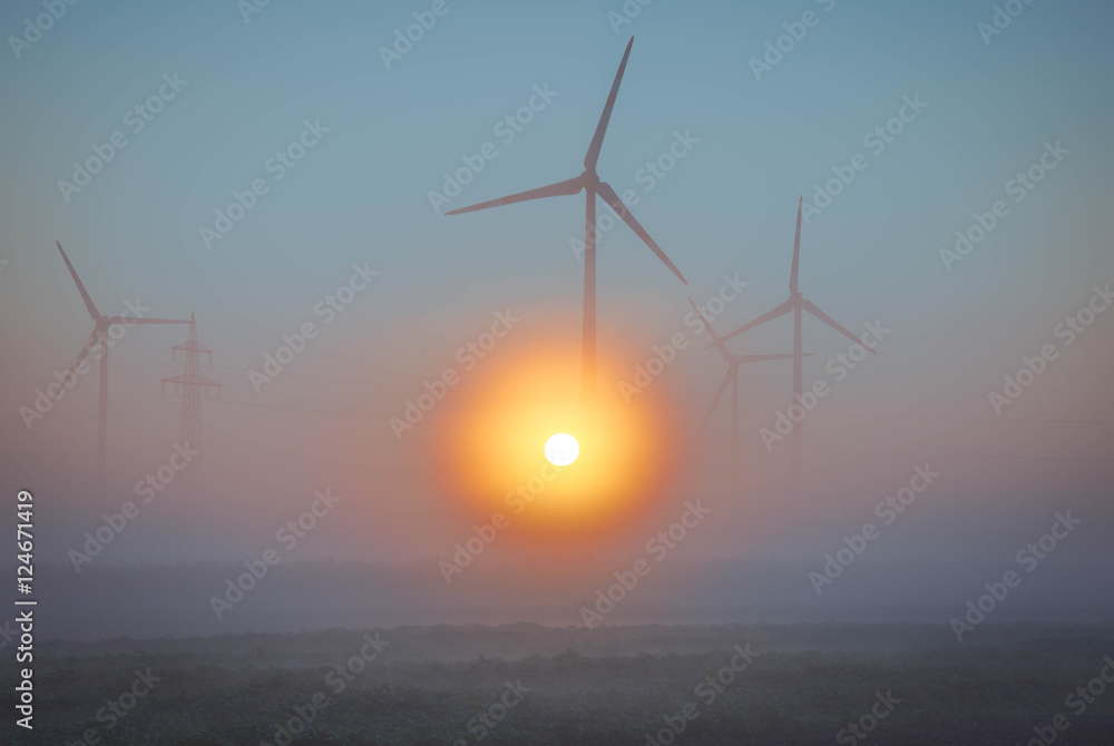 Wind power on field with Fog