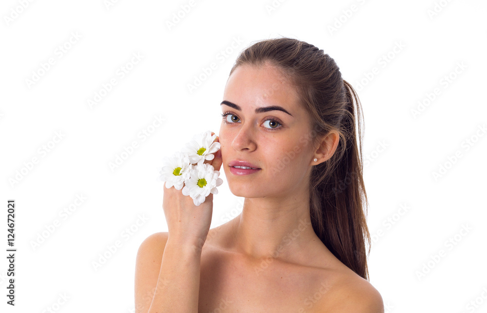 Young woman holding white flowers Young woman holding white flowers