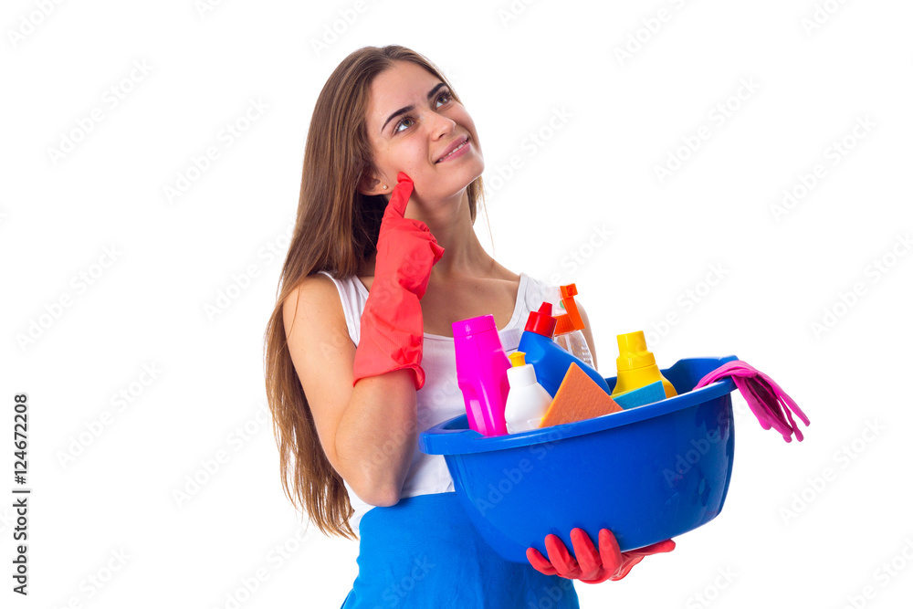 Woman holding cleaning things in washbowl Woman holding cleaning things in washbowl
