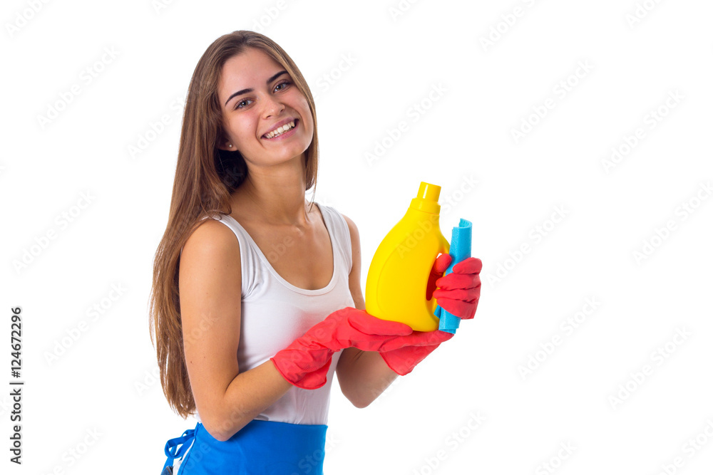 Woman holding duster and detergent Woman holding duster and detergent