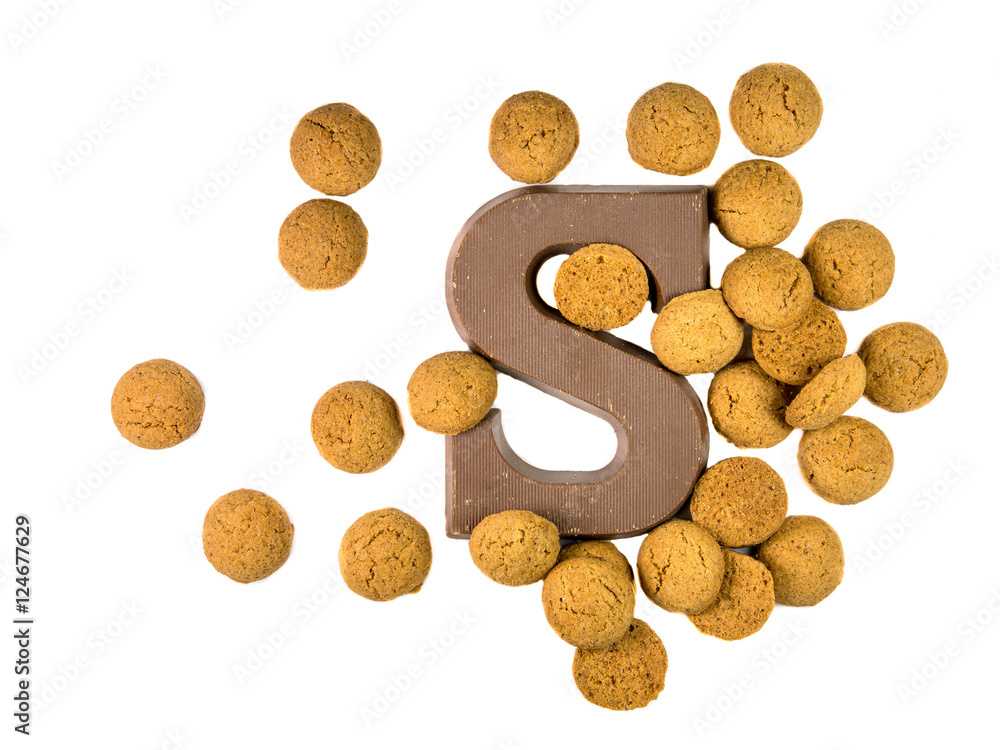 Bunch of Pepernoten cookies with chocolate letter Bunch of Pepernoten cookies with chocolate letter