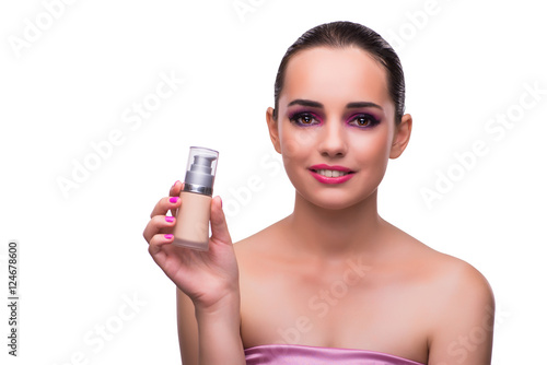 Woman with a bottle of cream isolated on white