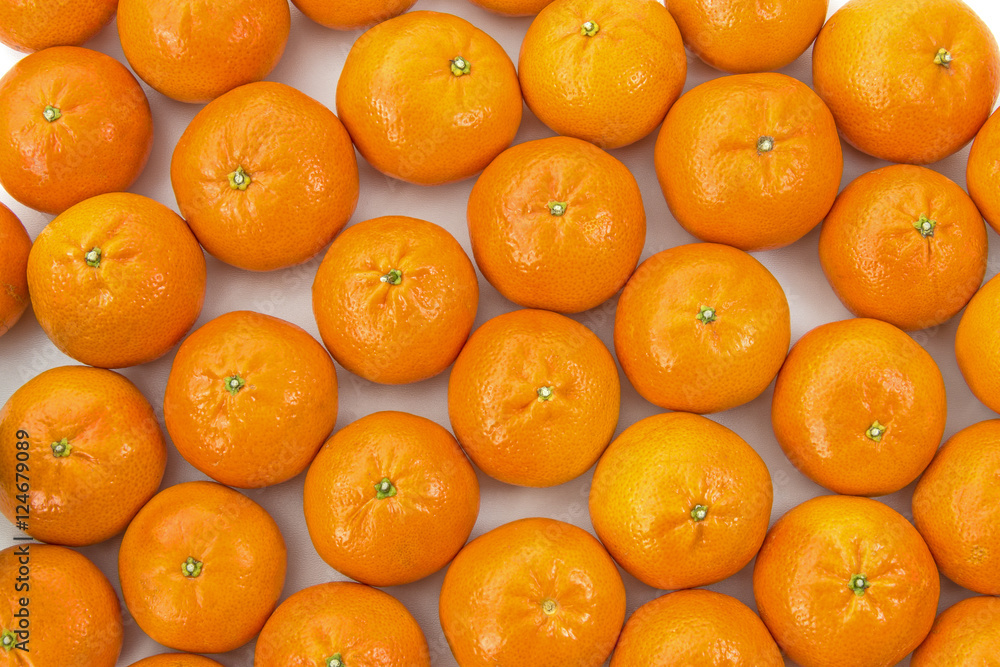 Clementines layed out side by side Clementines layed out side by side