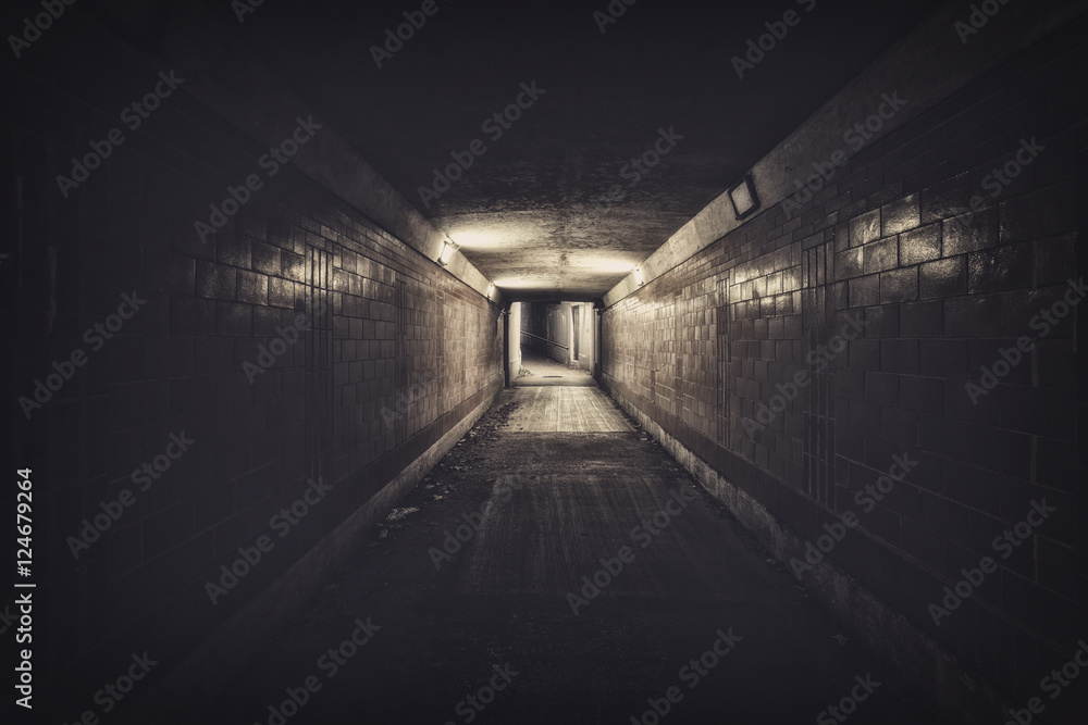 Empty underpass tunnel at night, desaturated colors