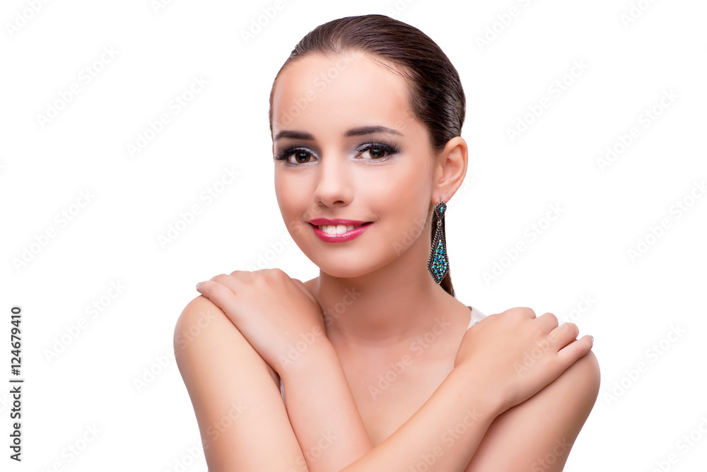 Young woman showing off her jewellery isolated on white