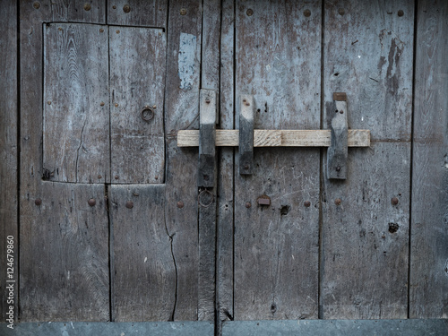 Rustic and old wooden gate close-up