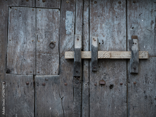 Rustic and old wooden gate close-up