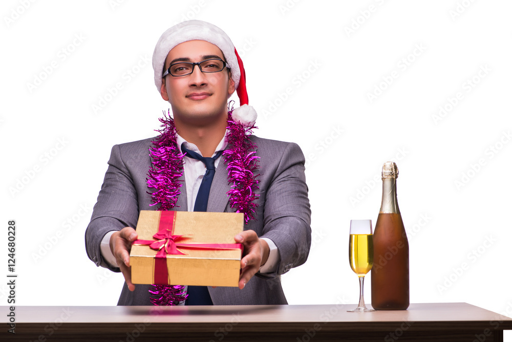 Young businessman celebrating christmas in office Young businessman celebrating christmas in office