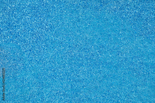 Top view of blue swimming pool and water splash.