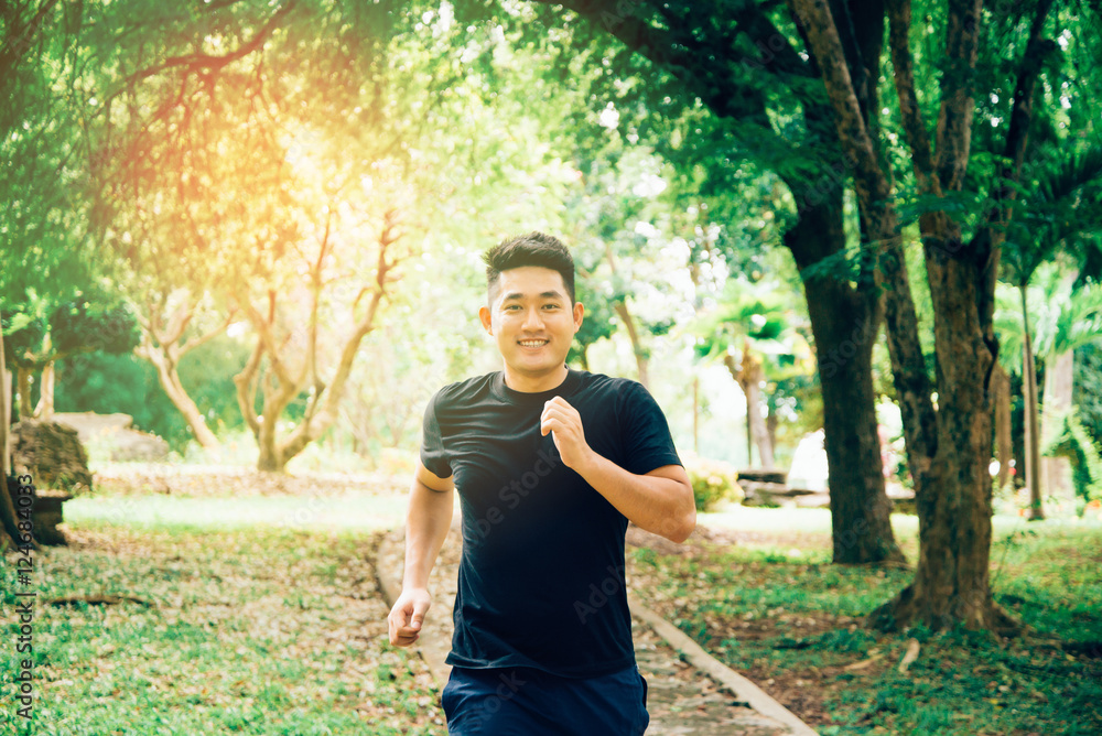 A young man running in the nature. Healthy lifestyle
