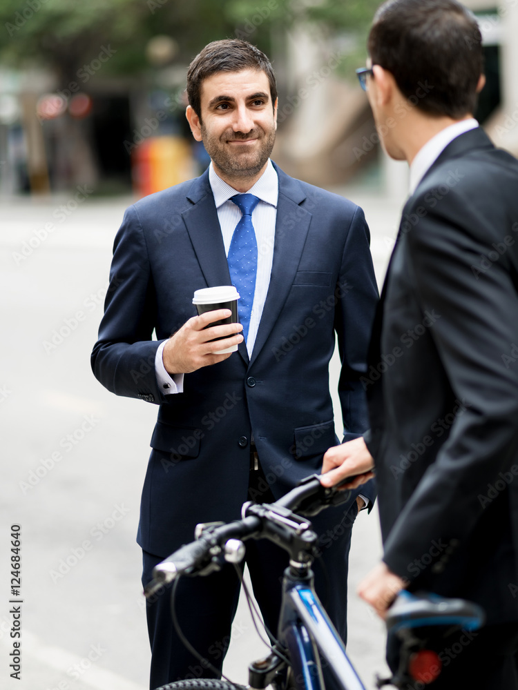 Young businessmen with a bike