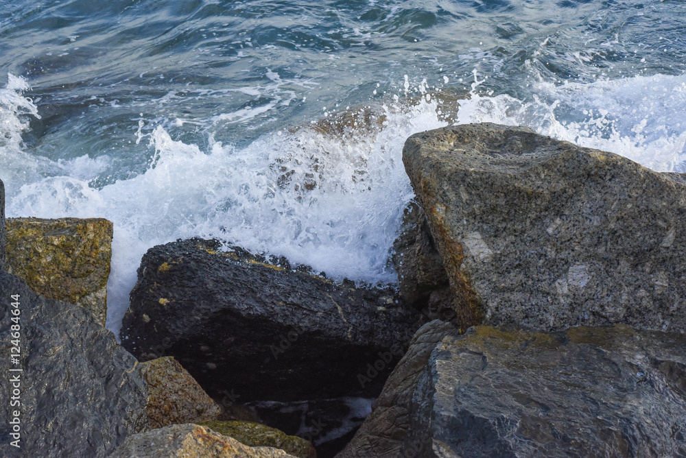 waves breaking on the shore with sea foam waves breaking on the shore with sea foam