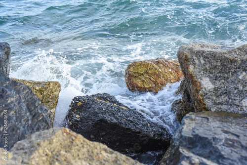 waves breaking on the shore with sea foam