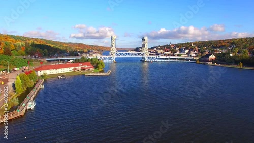 Scenic Portage Lake Lift Bridge connecting Houghton and Hancock Michigan amid Autumn Colors, aerial view.