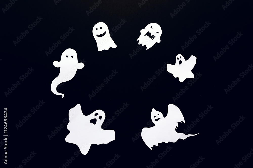 Fototapeta premium Happy Halloween background with frame of ghost cut out of paper.