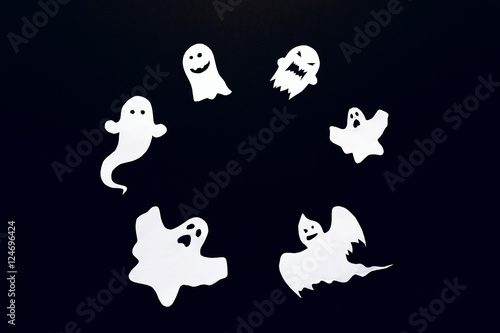 Happy Halloween background with frame of ghost cut out of paper.