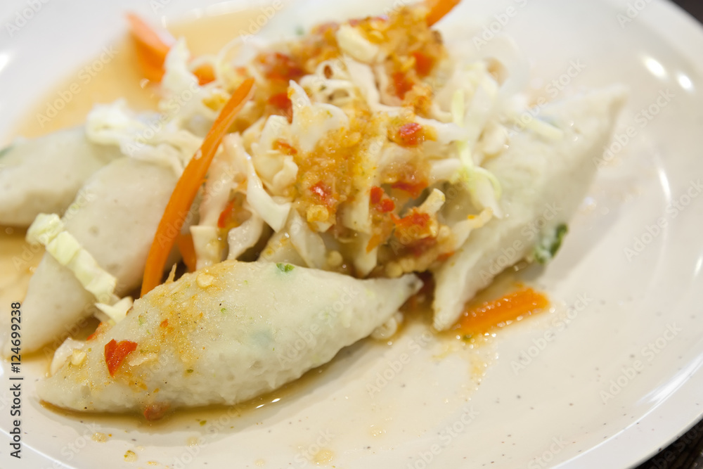 Spicy fish ball or meat ball with vegetable on white dish