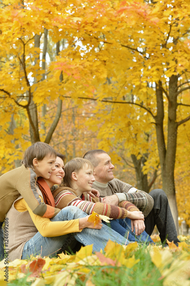 Family relax in autumn park Family relax in autumn park