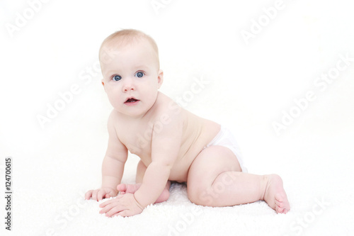 7 month cute happy baby girl in diaper © ivolodina