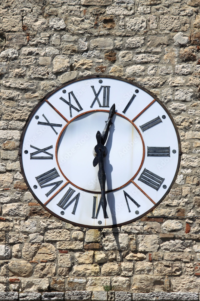 The clock of Clock tower of Todi, Italy