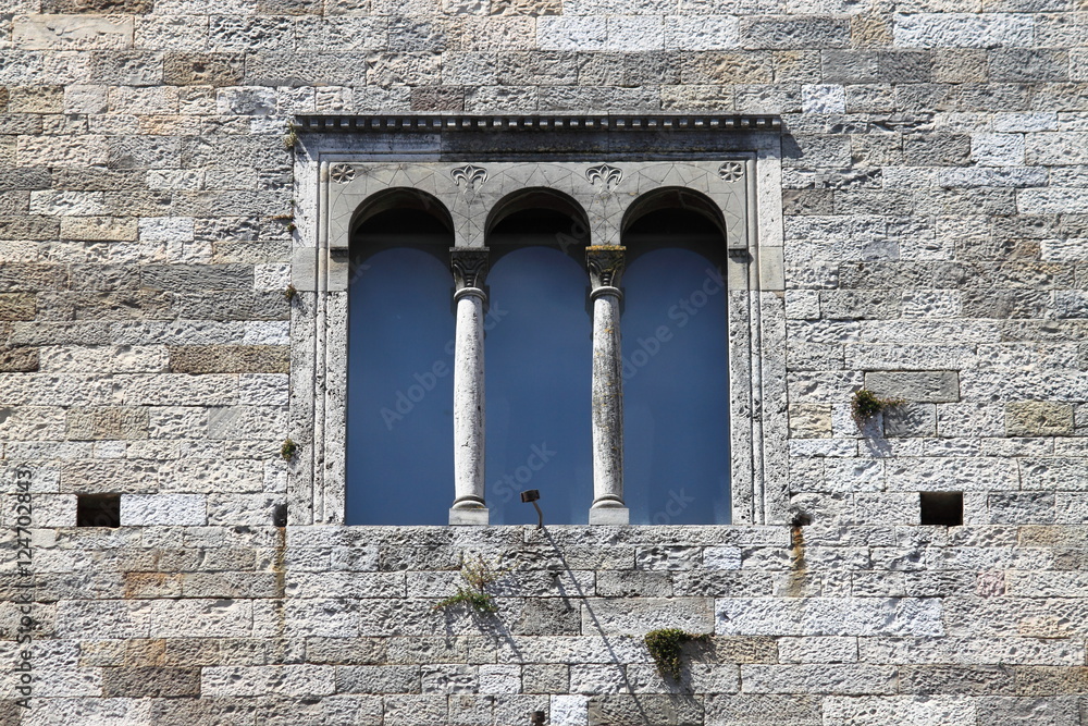 Medieval window in Todi. Umbria, Italy