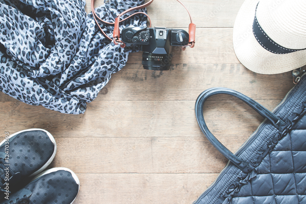 Flat lay photography with camera, travel accessories, essential
