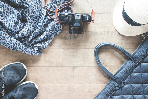 Flat lay photography with camera, travel accessories, essential