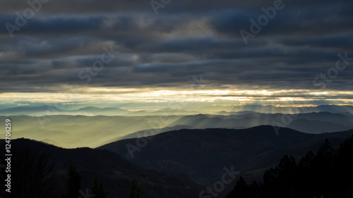 Rolling hills and mountains at autumn sunset, view from Bobija mountain, west Serbia