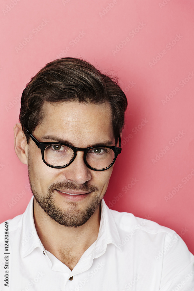 Handsome guy in spectacles in studio