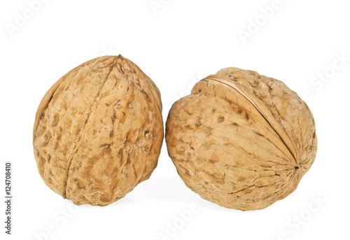 Two walnuts isolated on a white background