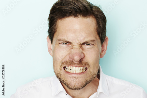Tableau sur toile Angry man clenching teeth at camera