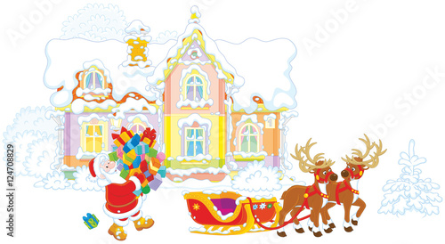 Santa Claus carrying a pile of Christmas gifts to a sleigh with reindeers against the background of his house
