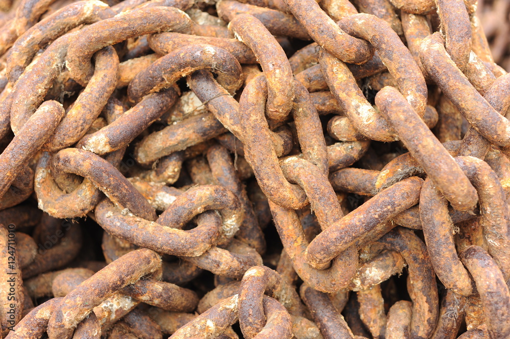 Rusting metal chains by the sea. Rusting metal chains by the sea.