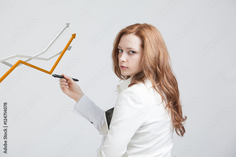 Businesswoman working with growth graph on grey background Businesswoman working with growth graph on grey background
