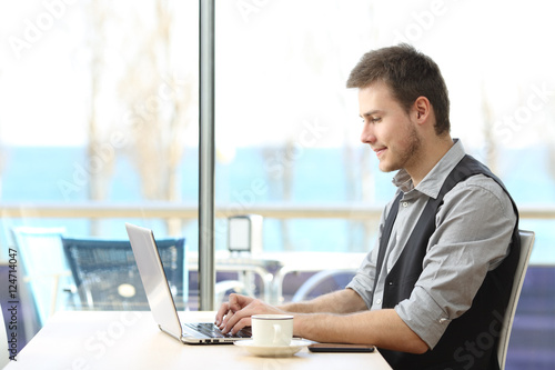 Businessman working on line in a coffee shop