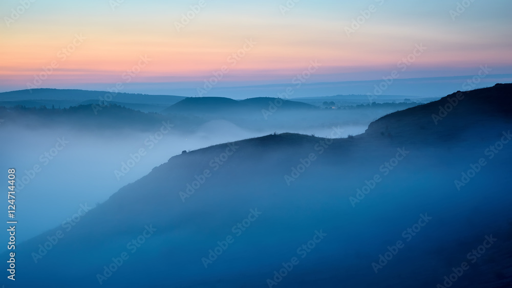 autumnal foggy sunrise