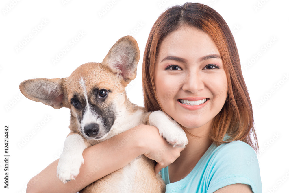 Young asian woman with a little puppy isolated over a white back Young asian woman with a little puppy isolated over a white back