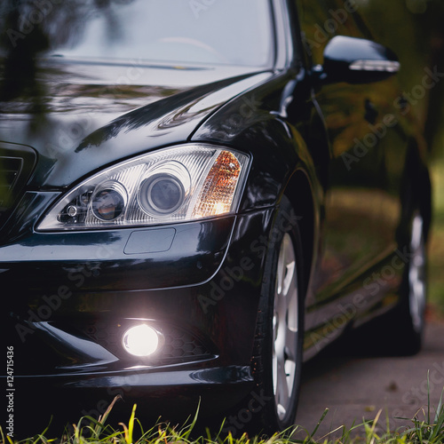 headlights of dark blue car. © kucheruk