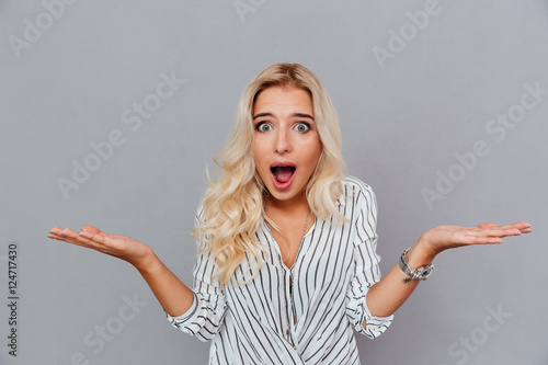 Portrait of surprised woman with mouth open standing