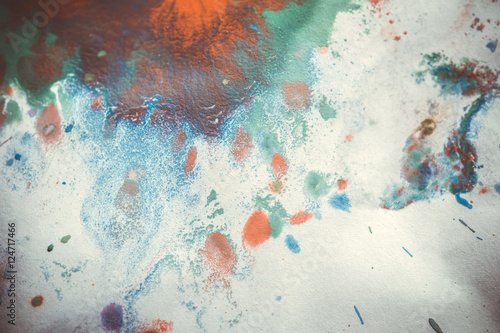 colorful blots splashing on a white background photo