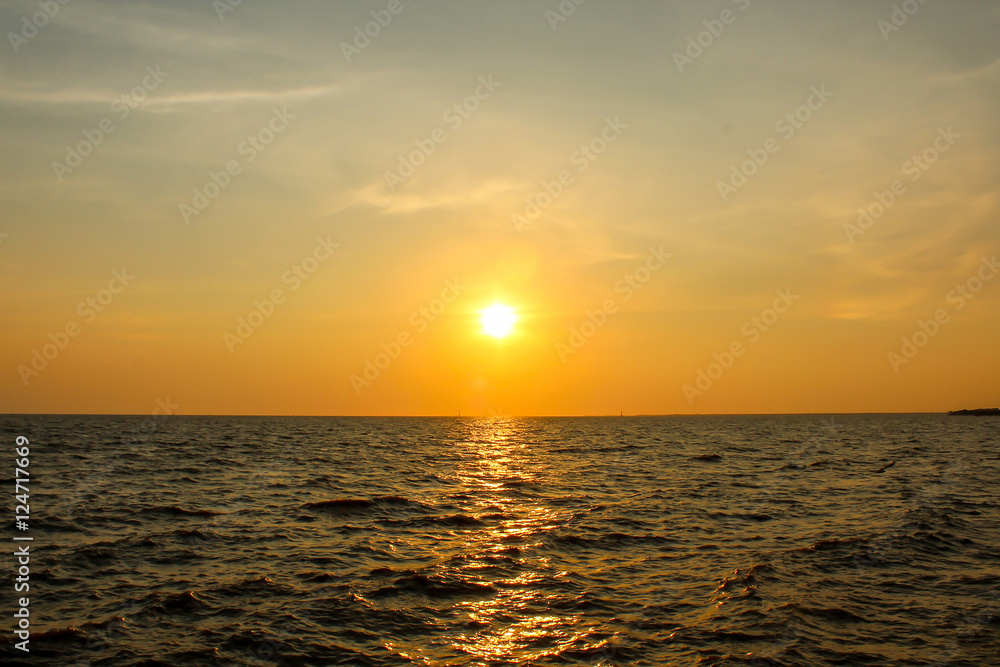 Sunset over sea water.
