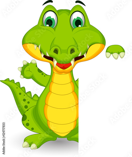 funny crocodile cartoon posing with blank sign