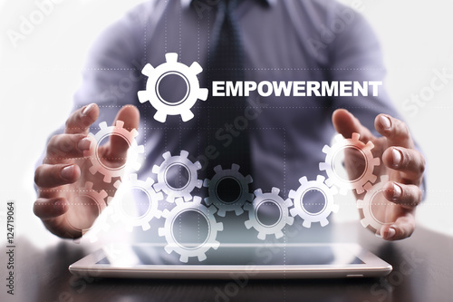 Quadro em tela Businessman is using tablet pc and selecting empowerment