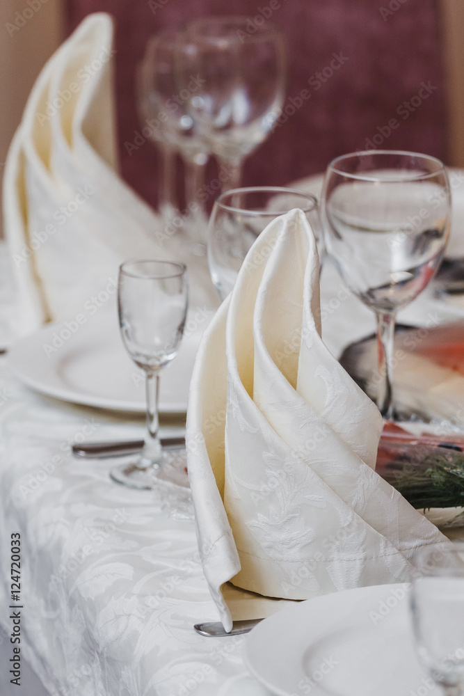 Empty glasses set with napkin in fine dining restaurant