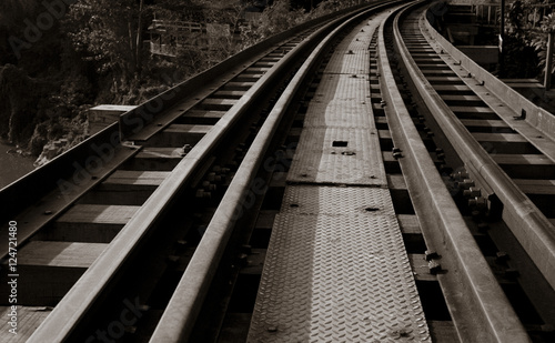 Railroad track curve around a bend in thailand