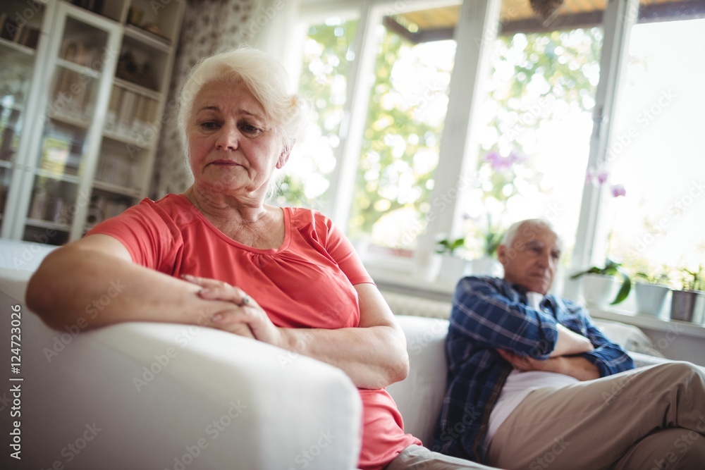 Upset senior couple ignoring each other Upset senior couple ignoring each other