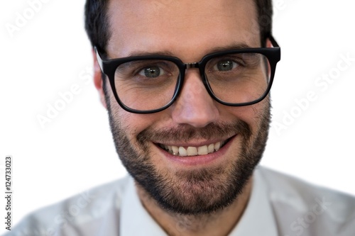 Fototapeta Naklejka Na Ścianę i Meble -  Confidence businessman smiling against white background